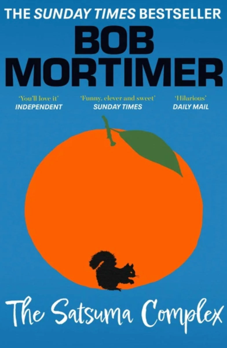 Event’s Book Club September pick: "The Satsuma Complex"—a contemporary fiction mystery featuring a cover with a large orange, green leaf, black squirrel silhouette, review quotes, and "THE SUNDAY TIMES BESTSELLER" tagline.